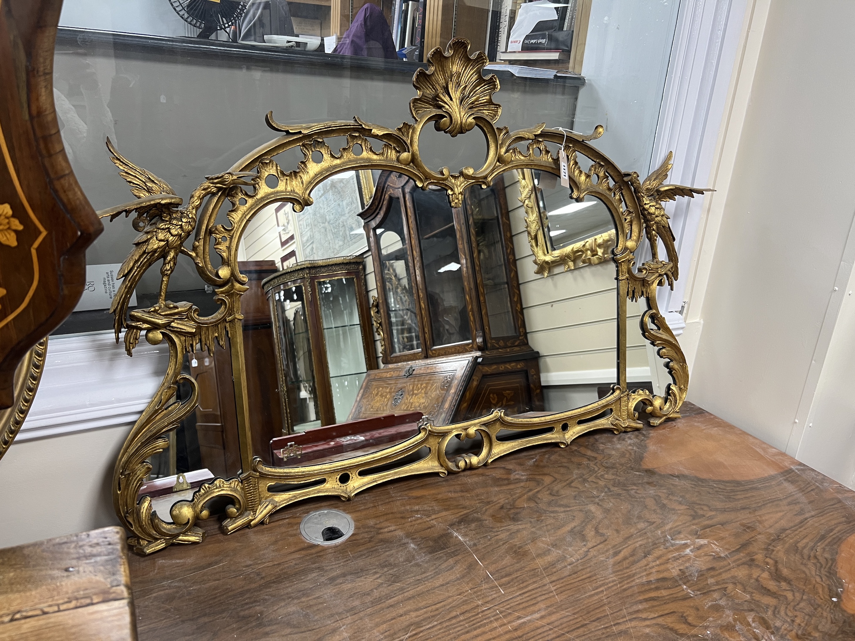 An 18th century style carved giltwood and composition wall mirror, width 122cm, height 80cm